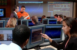Students at work in the Soin Trading Center in the College of Business.
