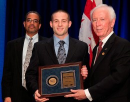 Jason Thuener, (center) receives the 2011 AMA Foundation Leadership Award from Richard Hubbard, M.D., Senior Director, External Medical Affairs, Pfizer Inc., (left) and Cecil Wilson, M.D., President, American Medical Association, (right).