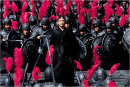 Single frame from the movie Hero showing the proagonist in the center with an army of soldiers following behind him.