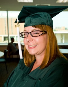 Photo of Tara Purvis in her graduation cap and gown.