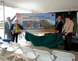 Photo of the artist's rendering being revealed at the groundbreaking