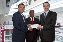 Photo of Mark Romito, (right) director of external affairs for AT&T Ohio, presenting a $10,000 check to S. Narayanan, (left) dean of the Wright State College of Engineering and Computer Science. The check is a gift for the Wright STEPP program. At center is Ruby Mawasha, assistant dean and program director of Wright STEPP.