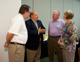 Photo of David Kalsbeek speaking to Rober Sweeney, Berkwood Farmer and Bonnie Mathies.