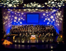 Photo of the orchestra and choir onstage at the Schuster Center.