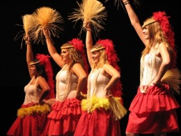 Photo of female students dressed up as Polynesian dancers performing at the 2010 Multicultural Halloween.