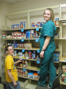 Wright State students help to stock the Friendship Food Pantry on campus.