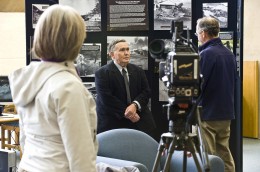 Photo of Edward Haas being interviewed by a local TV news crew about Pearl Harbor.