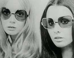 Photo of two women from the 1970s wearing sunglasses.