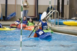Photo of grade school students participating in kayaking competition in the Wright State pool.