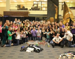Photo of Wright State Greeks students that partcipated in the second-annual Pan Hellenic canned food sculpture contest.