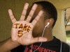 Photo of hand with the words "Take 5" written on the palm