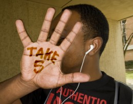Photo of hand with the words "Take 5" written on the palm