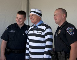Photo of President Hopkins in fake prison garb for a March of Dimes fundraiser