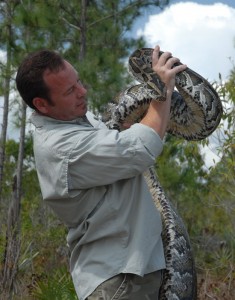 Photo of Shawn Heflick, a Wright State University graduate who stars in Python Hunters—a TV show that chronicles Heflick wrestling, capturing and saving giant pythons in the Florida Everglades.