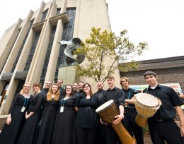 Photo of some members of the Collegiate Chorale outside the Christ Church Cathedral.