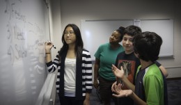 Photo of Ms. Jennille Love (green), James Durbin (green and black) Christine Kim (stripes) and Grant Crawford (red and black) in the Talk About It class where students learned about how to constructively deal with conflict and disagreement.