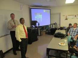 Photo of Lake Campus Engineering Director Ruby Mawasha and Crown employee Jeff Davis during a presentation by Davis about software used by Crown Equipment.