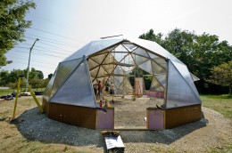 Photo of the greenhouse while under construction.