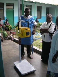 Photo of a simple portable veterinary X-ray machine crudely welded to a stand served as the group's X-ray machine for pateints.