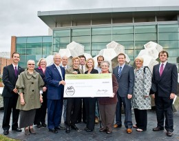 Photo of a bunch of people with a giant check