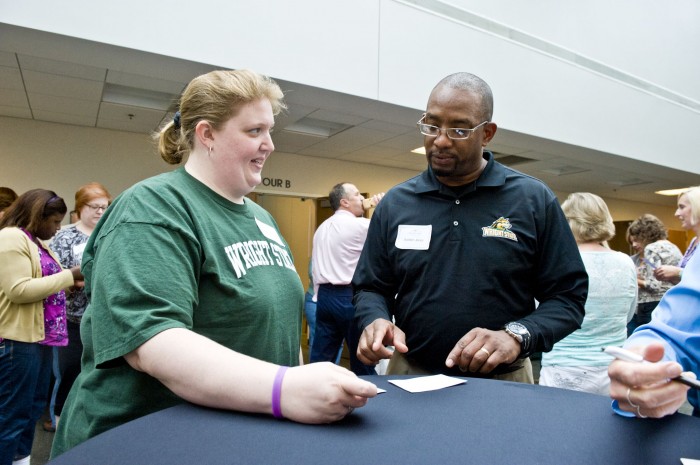 Photo of Elizabeth Styers and Audwin Jones, chairs-elect of CSAC and USAC, participate in an activity during Staff Development Day last July