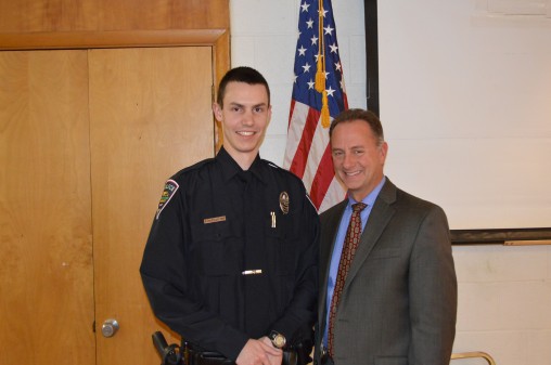 Officer Tyler G. Pottkotter (left) received a Knights of Columbus Blue Coat Award from the Fairborn Chapter for his service to the community. Wright State Police Chief David Finnie stands at right.