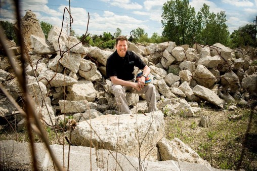 Jim Gruenberg sitting on rocks at Calamityville