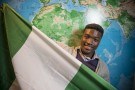 Charles Chugo Chibugo Chiobi holding Nigerian flag