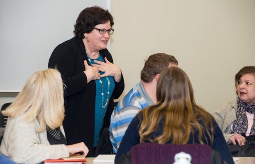 Susan Lightle, professor of accountancy, meets with Master of Accountancy students during a recent class. (Photo by Erin Pence)