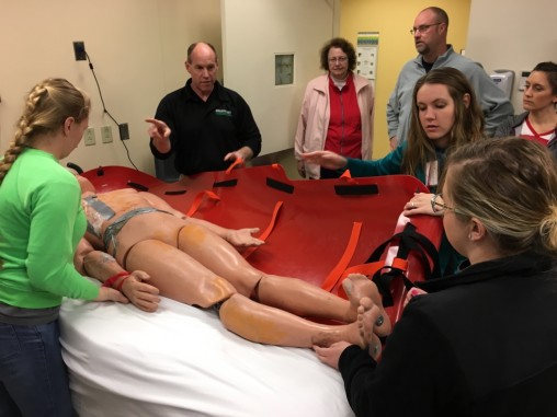 Interprofessional teams participate in a four-day advanced disaster life saving course, which included learning techniques to transport patients safely up and down flights of stairs during an emergency.