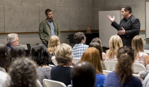 Lucian Read, “America Divided” co-creator, left, and Joseph Keferl, College of Education and Human Services dean, talk about “America Divided,” an eight-part docu-series. (Photo by Will Jones)