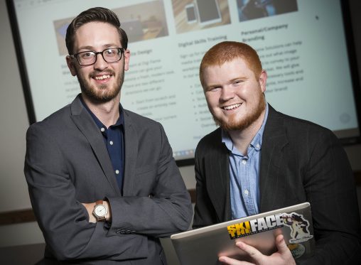 Bruce Heintz, left, a mass communication major, and Jamie Stacy, a marketing major, are social media and marketing enthusiasts who launched Digi Flame Solutions. (Photo by Chris Snyder)