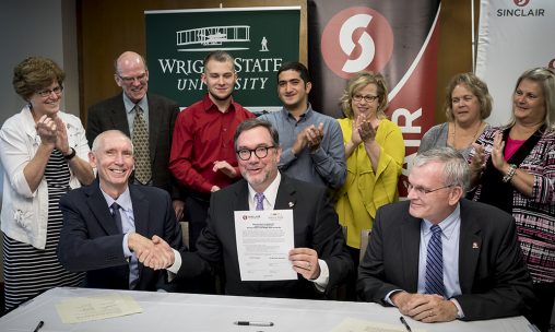 Wright State Provost Thomas Sudkamp, left, and Sinclair College President Steven Johnson shake hands after signing a Memorandum of Agreement for the Double Degree Program, which enhances access to bachelor’s degree programs at Wright State for Sinclair students. (Photo by Will Jones)