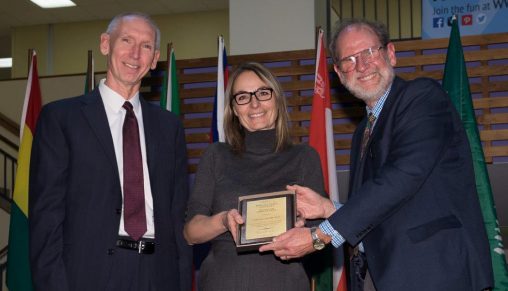 Pascale Abadie, assistant professor of French, accepted the 2016 International Education Award from Provost Thomas Sudkamp, left, and Henry Limouze, interim associate vice president for international affairs. (Photo by Erin Pence)