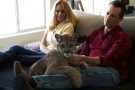 photo of couple with pet cougar