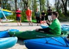 Photo of instructor showing proper sitting technique on the beach during Wright State University's Introduction to Kayaking class.