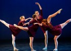 Photo of four dancers in purple.