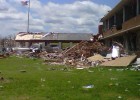 Photo of a school destroyed by the tornado, though the flag pole still stands.