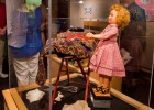 Photo of a display case with a doll.