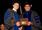Photo of SOPP Dean Larry James presenting the Dean's Award to SOPP Graduate Brent Funk.