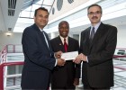 Photo of Mark Romito, (right) director of external affairs for AT&T Ohio, presenting a $10,000 check to S. Narayanan, (left) dean of the Wright State College of Engineering and Computer Science. The check is a gift for the Wright STEPP program. At center is Ruby Mawasha, assistant dean and program director of Wright STEPP.