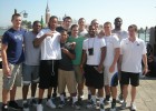Photo of the Wright State men's basketball team posing for a picture befor boarding gondullas in Venice, Italy.