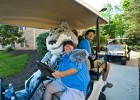 Photo of Rowdy Raider on a golf cart.