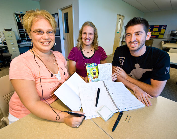 Photo of three students with smartpens.
