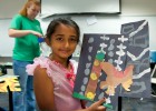 Photo of Lakha Choudary with her owl creation in “Imagination Destination” class with Pre-College camp instructor Michelle Muir.