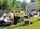 Photo of volunteers helping families move freshmen into the dorms.