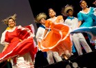 Photo of three female dances in Mexican dresses.