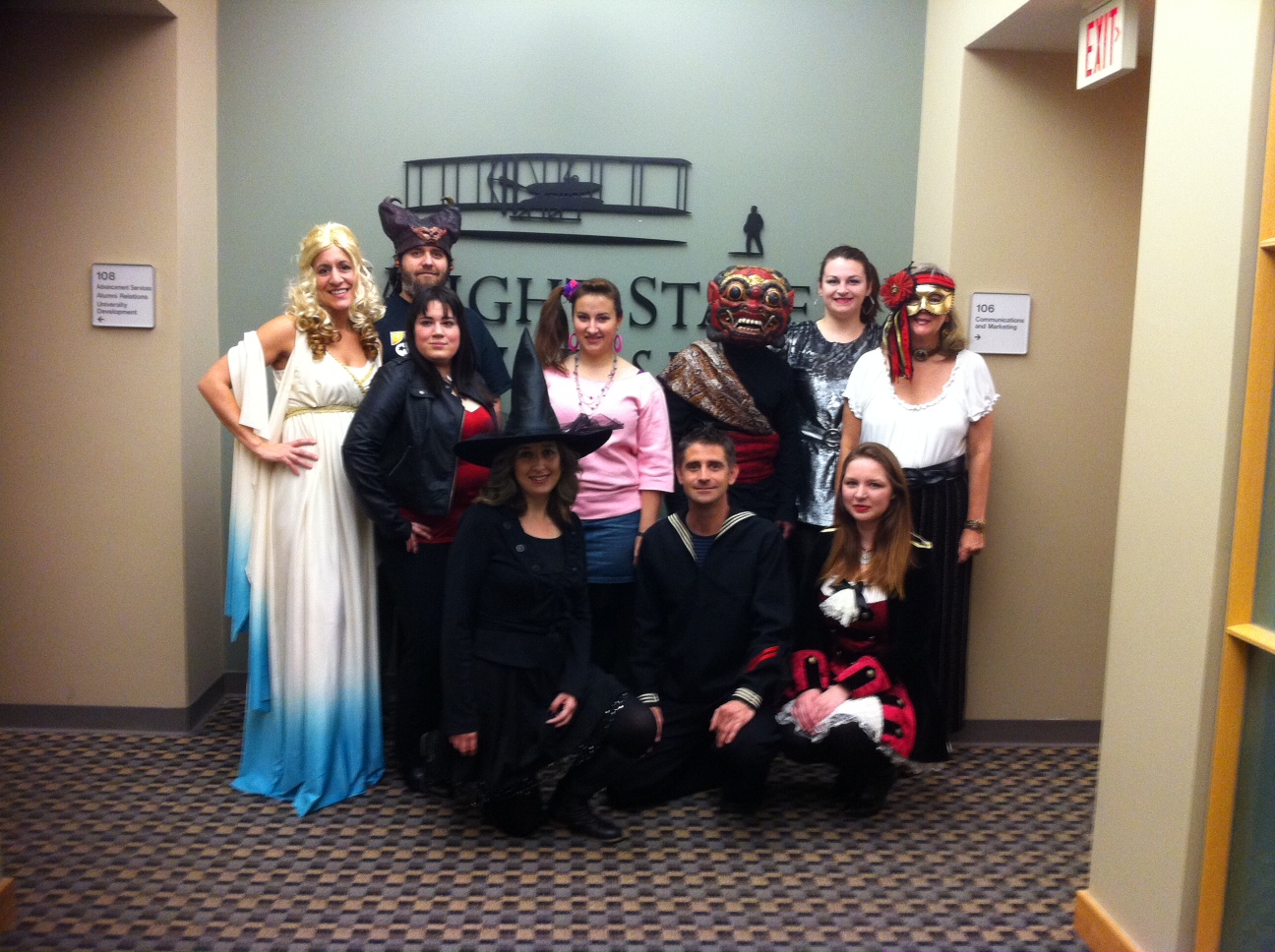 Photo of employees from the office of Communications and Marketing dressed up for Halloween at the office.
