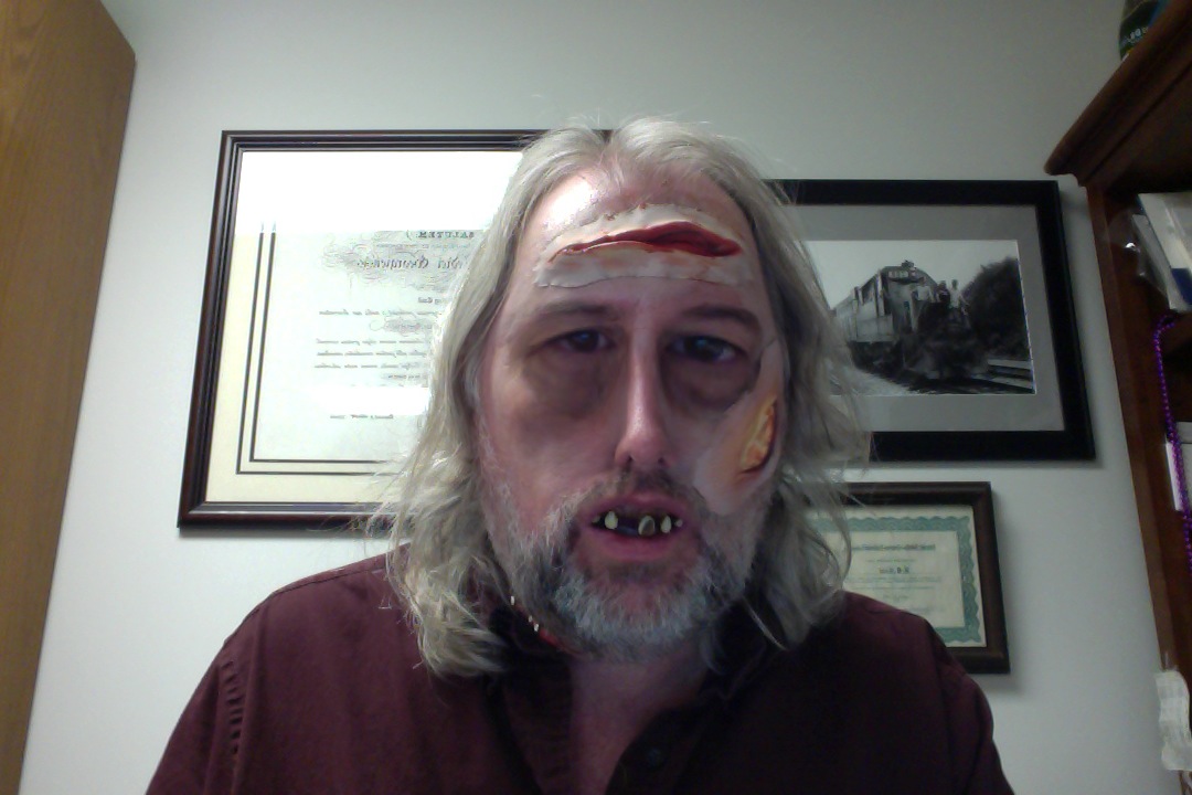 Photo of David Cool, Ph.D., associate professor of Pharmacology and Toxicology dressed up as a zombie.