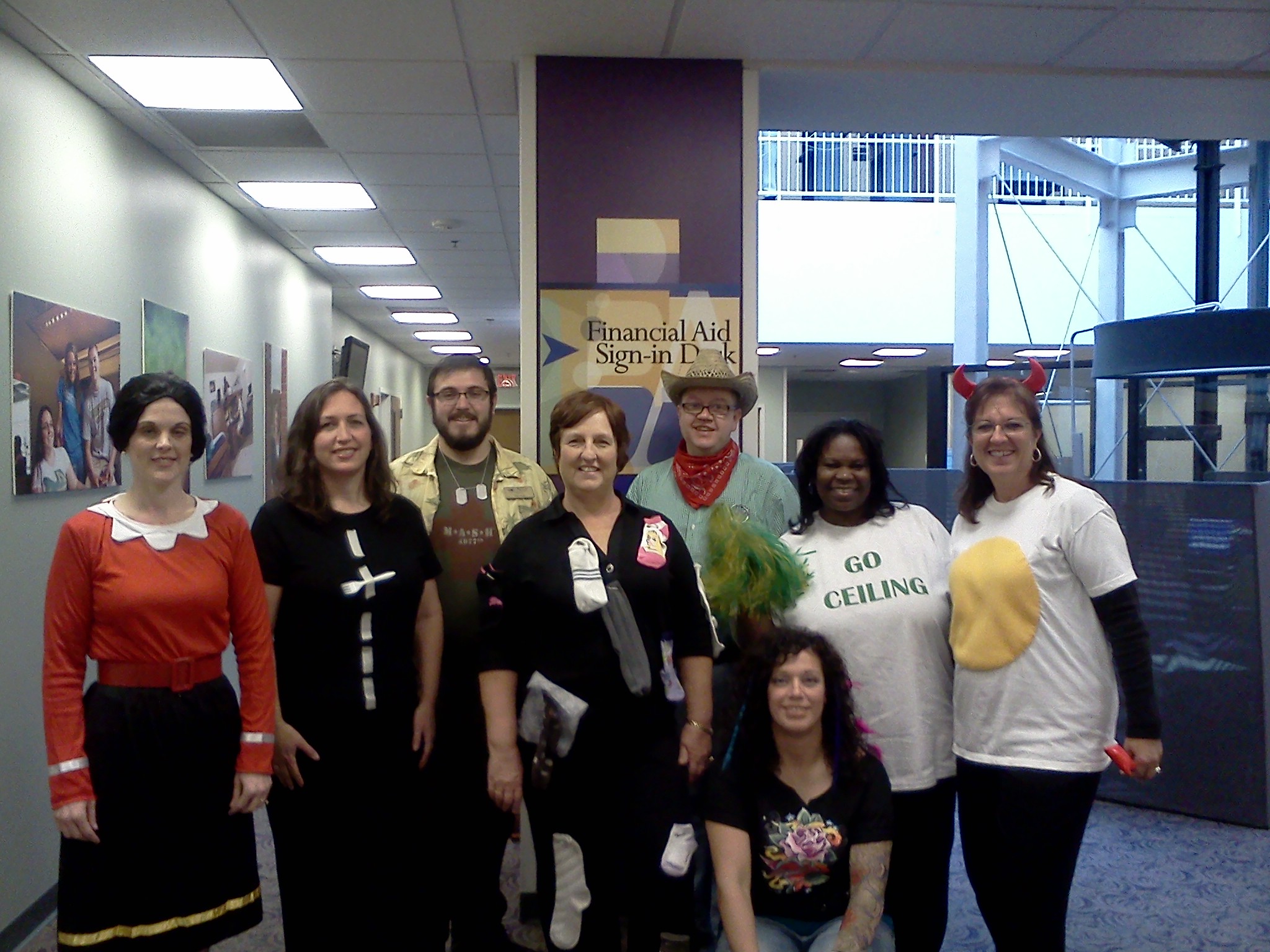 Photo of employees from the Wright State Office of Financial Aid dressed up for Halloween at the office.